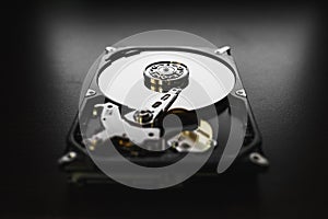Disassembled hard drive from the computer (hdd) with mirror effects. Part of computer (pc, laptop)