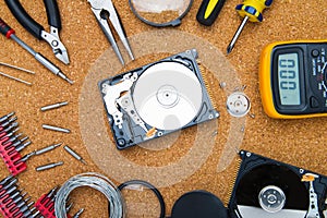 Disassembled hard drive and tools