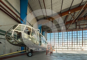 Disassembled helicopter repair stand in the hangar