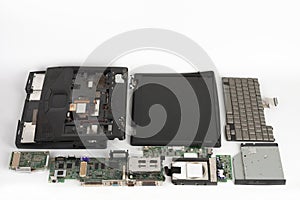 Disassembled laptop, basic components of notebook, screen, keyboard, motherboard, internal  hard disk drive, cd drive