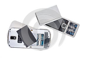 Disassembled old mobile phone isolated on white background.