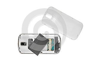 Disassembled old mobile phone isolated on white background.