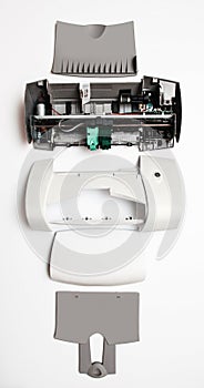 Disassembled printer on a white background