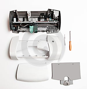 Disassembled printer on a white background