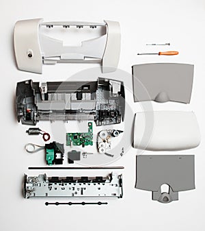 Disassembled printer on a white background