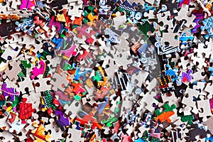 Disassembled puzzle colored pieces