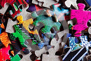 Disassembled puzzle colored pieces