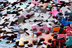 Disassembled puzzle colored pieces