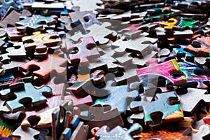 Disassembled puzzle colored pieces