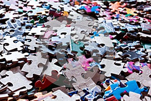 Disassembled puzzle colored pieces