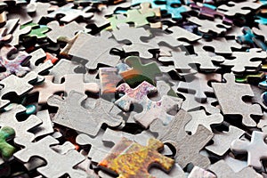 Disassembled puzzle colored pieces