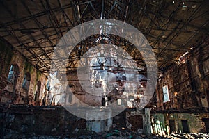 Disaster concept, inside old ruined abandoned industrial factory building, large creepy hall interior