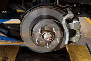 Disc brake of a car to be fixed at garage