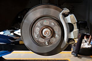 Disc brake of a car to be fixed at garage