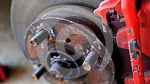 Disc brake of the vehicle for repair, in process of new tire replacement.