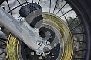 The disc brake of the vintage motorcycle.