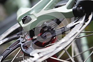 disc brakes on a bicycle wheel close-up. mountain bike detail close up