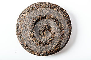 Disc of chinese puer tea on white background