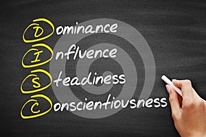 DISC Dominance, Influence, Steadiness, Conscientiousness acronym - personal assessment tool to improve work productivity, photo