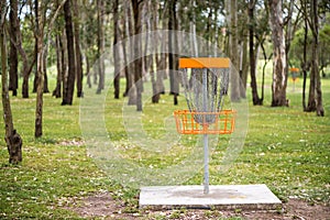 Disc golf basket in a park
