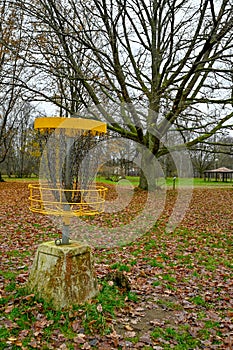 disc golf basket target in autumn park