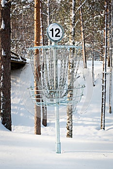 Disc golf basket in winter