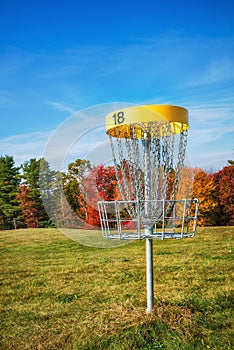 Disc golf hole basket in autumn