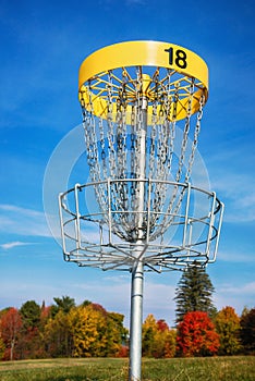 Disc golf target against blue sky