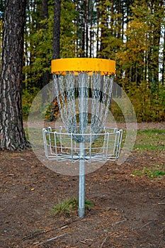 Disc golf target standing in big park in Kumla Sweden