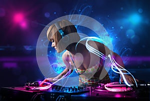 Disc jockey playing music with electro light effects and lights