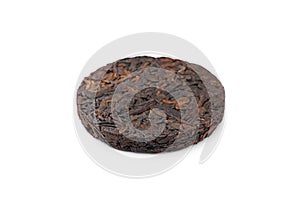 Disc shaped traditional Chinese pu-erh tea isolated on white