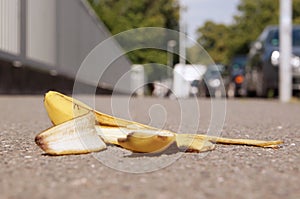 Discarded banana skin on pavement