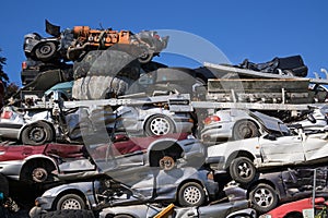 Discarded Cars Stacked at Junk Yard