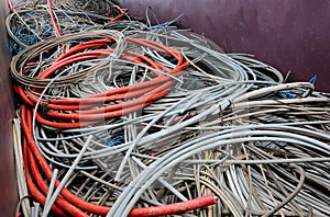 discarded electrical cords at the electrical cord scrapyard for recycling copper and polluting plastic