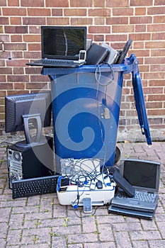 Discarded hardware put into a recycling container.