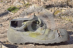 Discarded old torn shoes