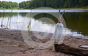 Discarded plastic bottle on lake
