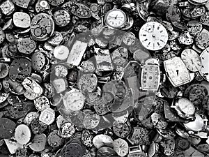 Discarded watch workings with bright faces