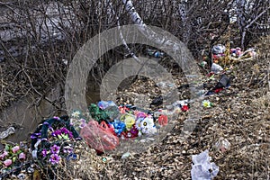 Discarded wreaths from a cemetery on the edge of the forest