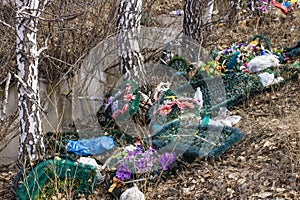 Discarded wreaths from a cemetery on the edge of the forest