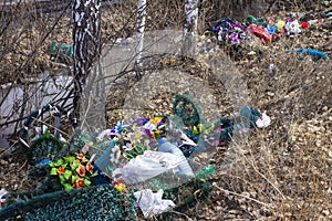 Discarded wreaths from a cemetery on the edge of the forest
