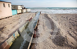 Discharge of dirty industrial wastewater into sea. Poisoning of recreation area by spread of disease, destruction of flora and