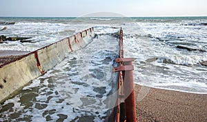 Discharge of dirty industrial wastewater into sea. Poisoning of recreation area by spread of disease, destruction of flora and