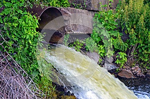 Discharge of water from the pipe in the river