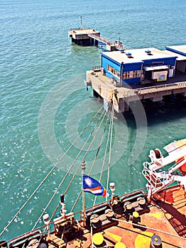 Discharging of cargo scrap metal from cargo ship in the port of Iskenderun, Turkey. A close-up view of cargo residues on the deck