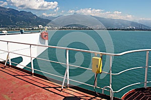 Discharging of cargo scrap metal from cargo ship in the port of Iskenderun, Turkey. A close-up view of cargo residues on the deck