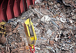 Discharging of cargo scrap metal from cargo ship in the port of Iskenderun, Turkey. A close-up view of cargo residues on the deck