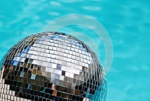 Disco ball with blue water background