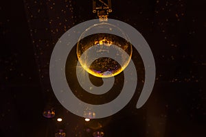 Disco ball with bright rays and night party background