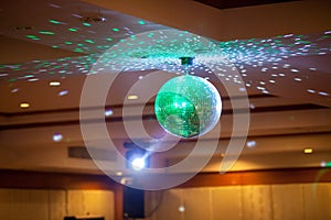 Disco ball with bright rays, night party background photo . party lights disco ball .